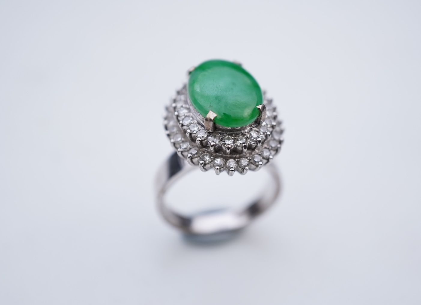 A jadeite and diamond ring